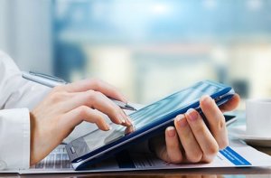 person using a tablet for patient registration